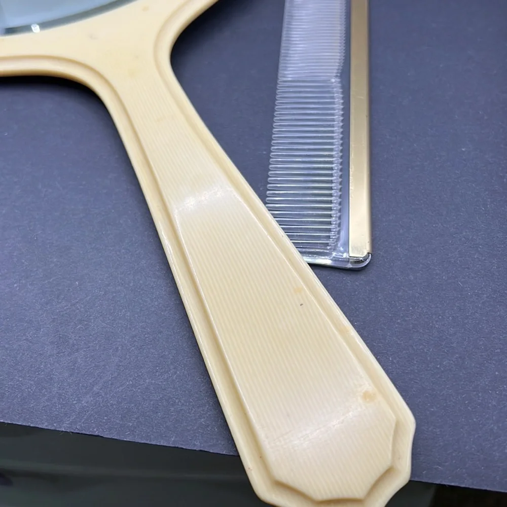 French Ivory 1950’s celluloid hand mirror and comb set